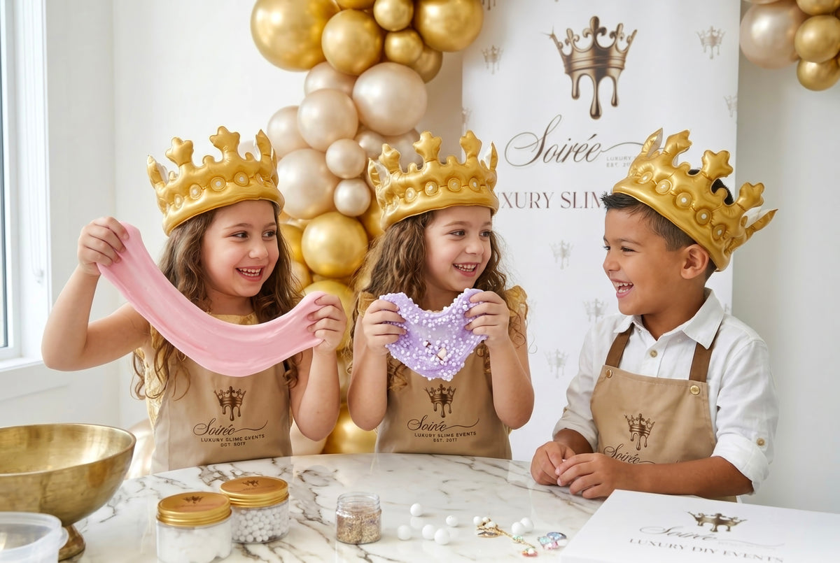 Children laughing together while stretching pink slime